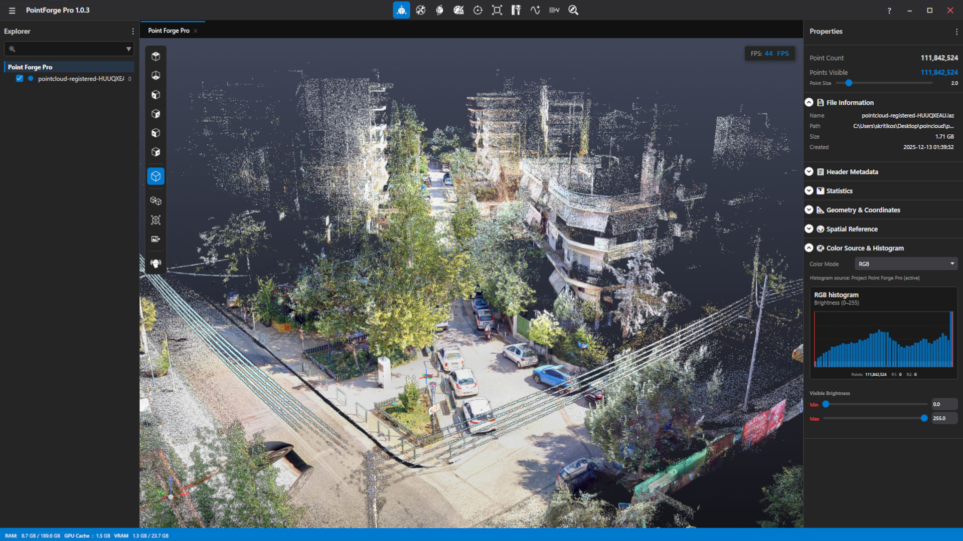 PointForge Pro displaying a colour point cloud of a city street, with the Scene Explorer tree on the left and the Properties panel with an RGB histogram on the right.