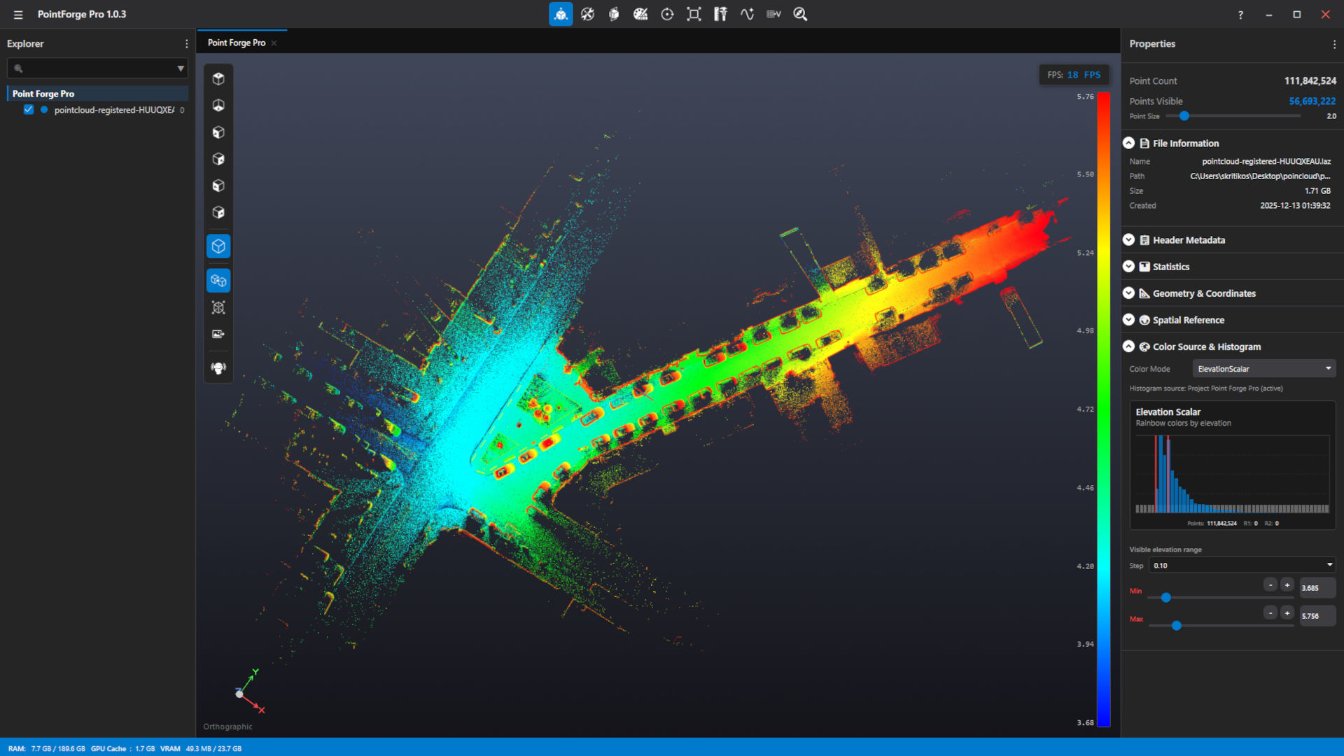 The same street scan seen from above in orthographic view, coloured by elevation from blue at the lowest points through green and yellow to red at the highest, with an elevation scale down the right-hand side.